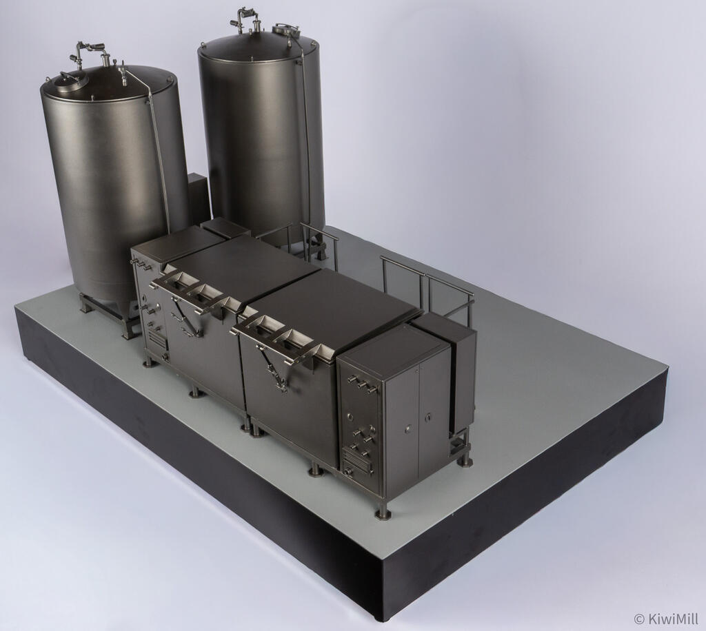 Rear view from above of the cook tank model, showing lid hinge brackets and pipe fittings on the end cabinets